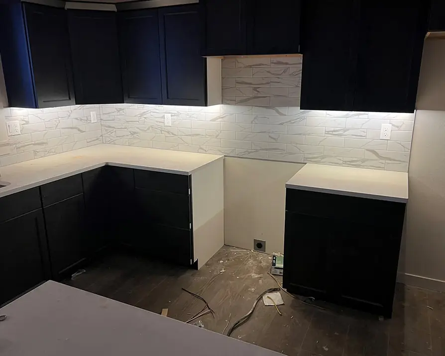 Kitchen with under-cabinet LED lights switched on